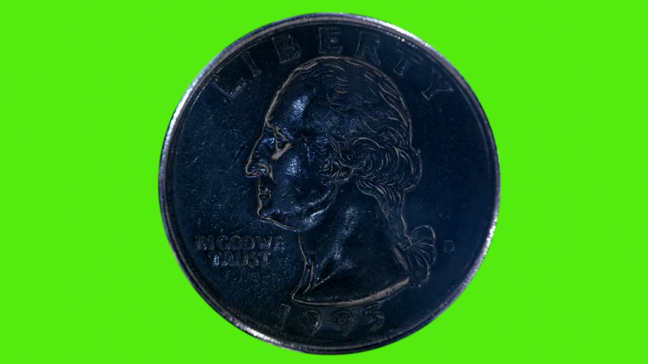 una moneda de diez centavos brilla en los rayos de luz