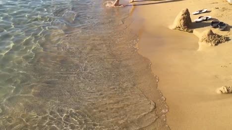 child playing on the beach