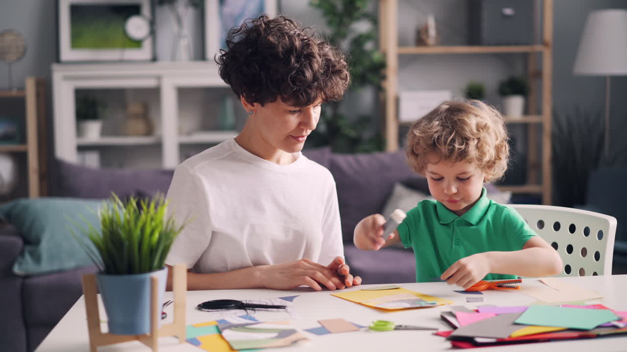 Mother and Son Doing Arts and Crafts at Home
