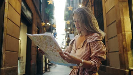 closeup tourist woman looking map outdoor. sexy girl searching address with map