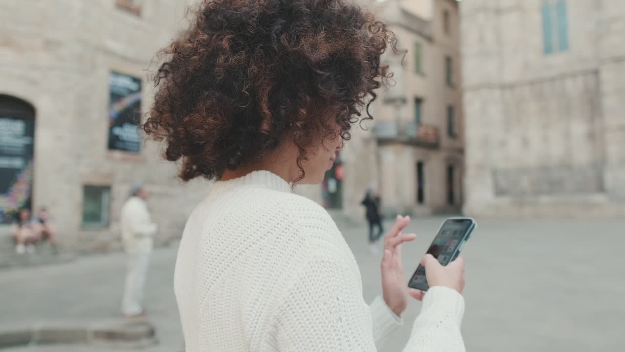 Woman using smartphone in city