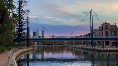 Wide-Perth-CBD-skyline-between-Trafalgar-Bridge-pylons,-Claisebrook-Cove,-East-Perth