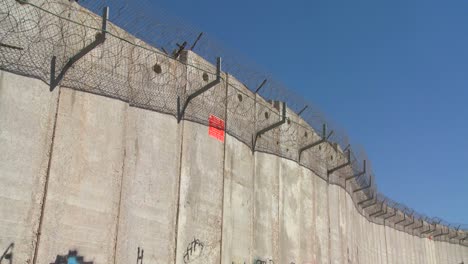 barbed wire adorns the top of the new west bank barrier between israel and the palestinian territories