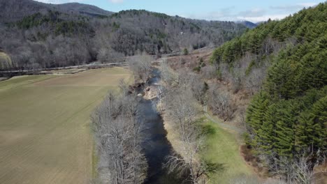 Valley-Crucis,-NC-river-running-through-mountains