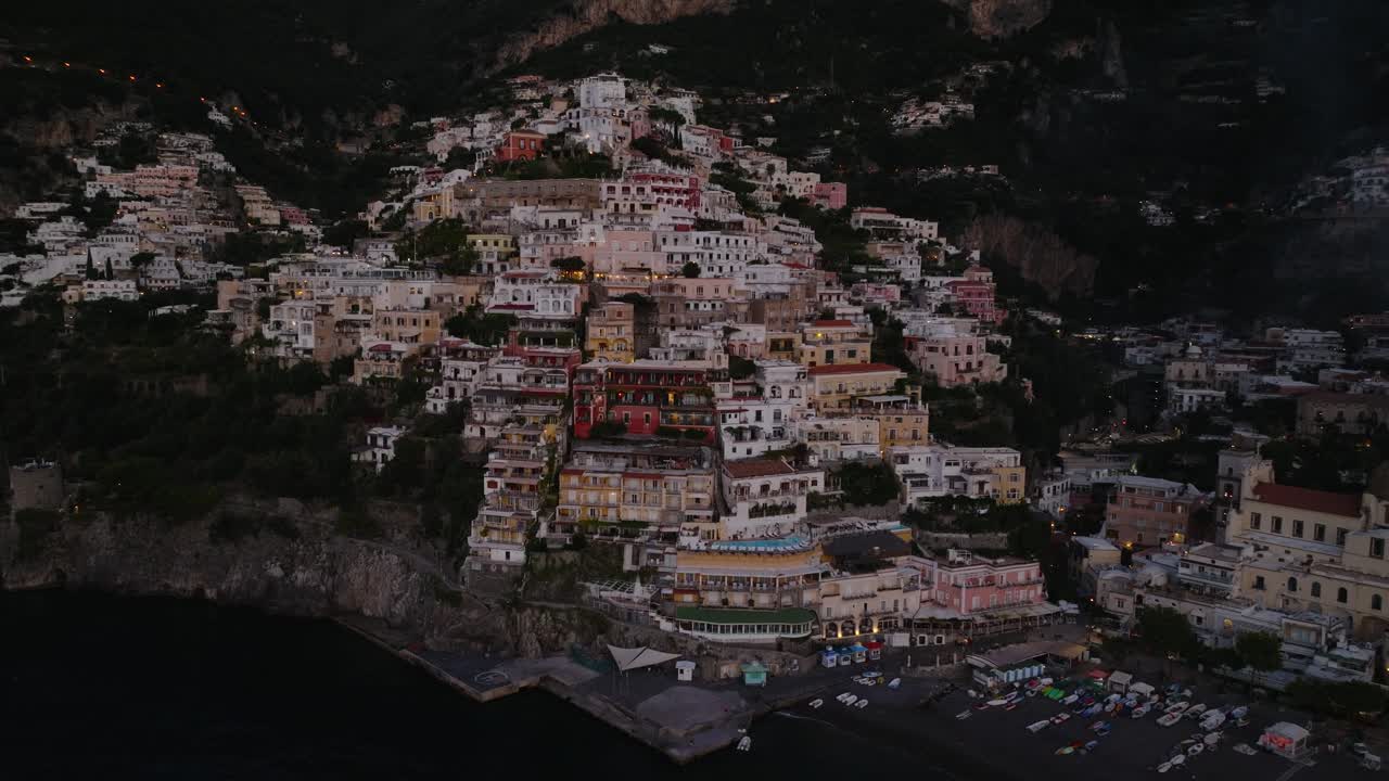 Flying Close To Positano Cliffside Village In The Mediterranean Sea At Sunset On Amalfi Coast, Southern Italy