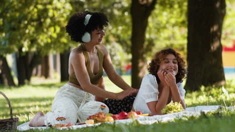 couple enjoying picnic together in the park