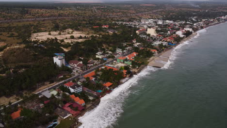 aerial, climate change rising sea levels eroding coastal southeast asia village