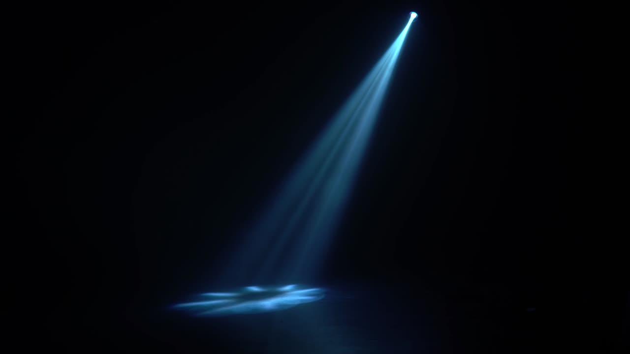 One beam from a lantern in a dark room