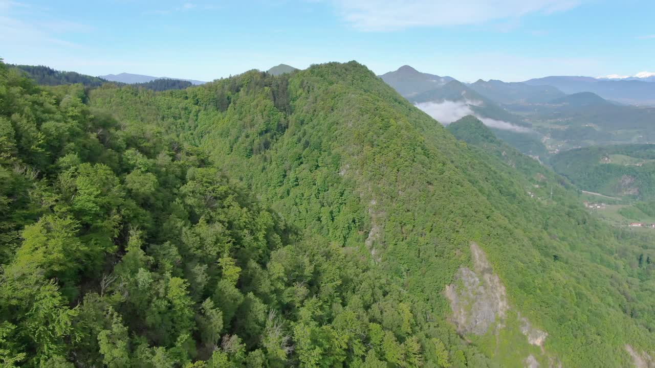 Aerial Drone Shot of Peaks of Dinaric Alps and Kocevje Town in Slovenia