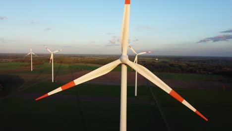 slow zoom out from a rotating windturbine in germany