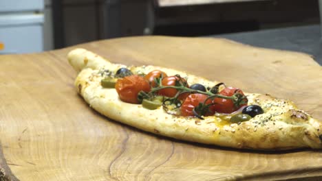 Preparing-a-traditional-Turkish-baked-pide-dish