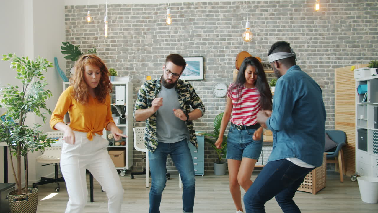 Friends Dancing in a Modern Office
