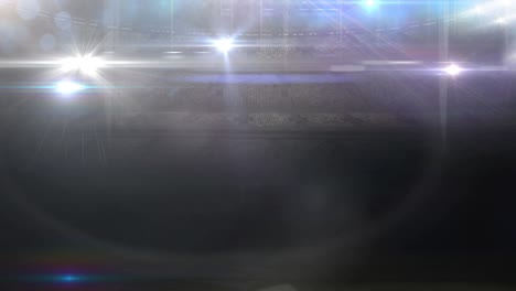 animación de luces en movimiento borrosas y puntos de luz bokeh en un estadio deportivo iluminado
