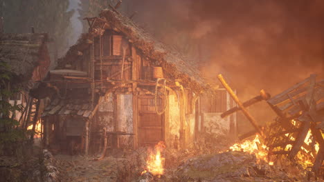 burning wooden house in old village