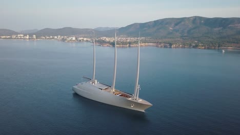 amazing drone footage in 4k of the beautiful sailing yacht "a" anchored at the coast of mallorca - puerto portals majorca - mediterranean sea - rich luxury lifestyle