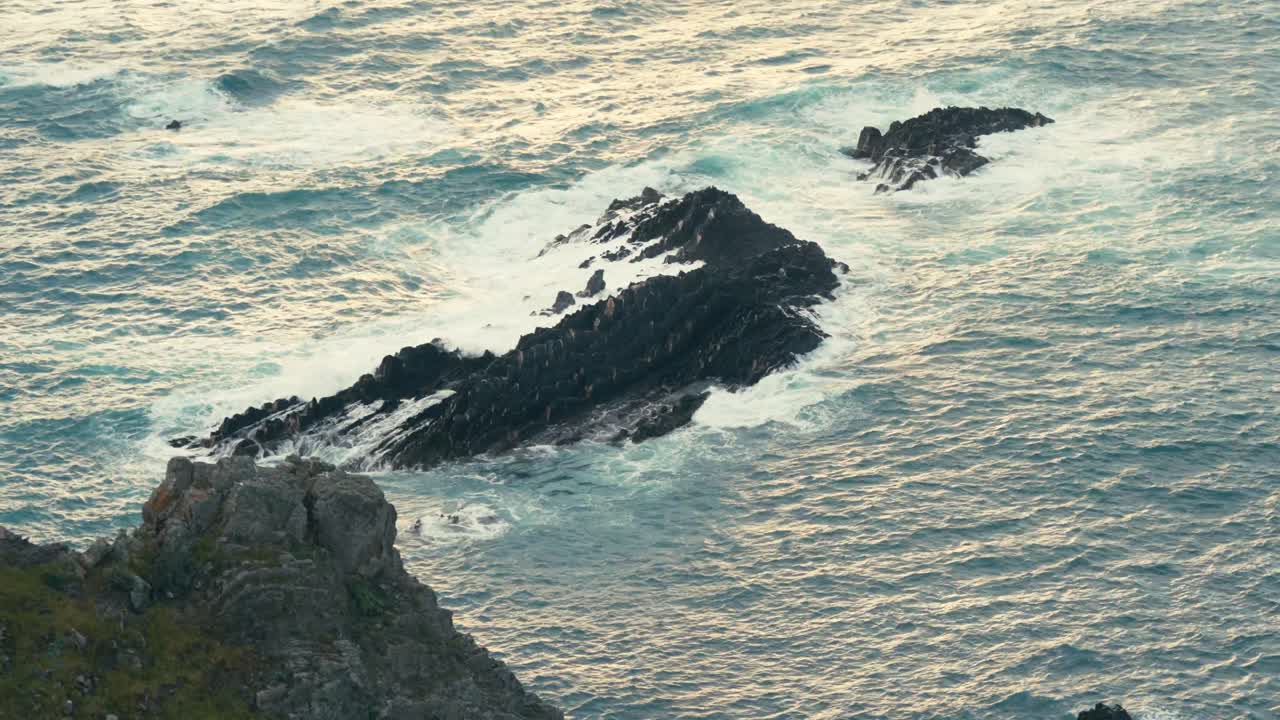 Breaking Rough Waves On Rocky Islands. Slow Motion Shot
