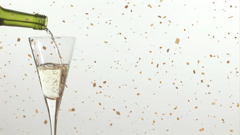 animation of confetti falling over champagne glass on white background