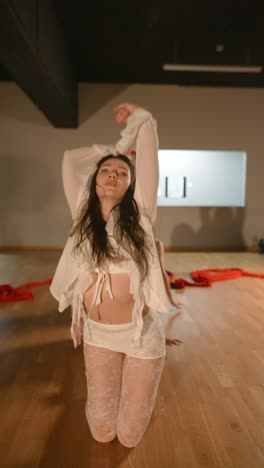 three women in white performing contemporary dance