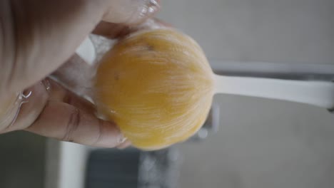 washing a lemon