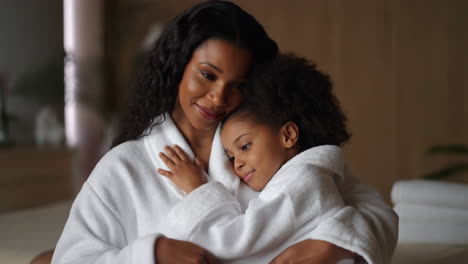 a loving moment between a mother and daughter at a spa