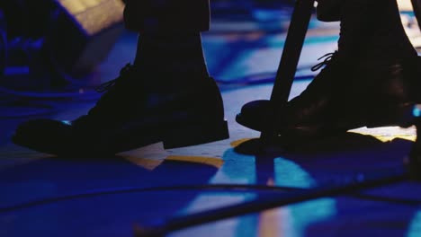 musician keeps the beat with high heels on stage