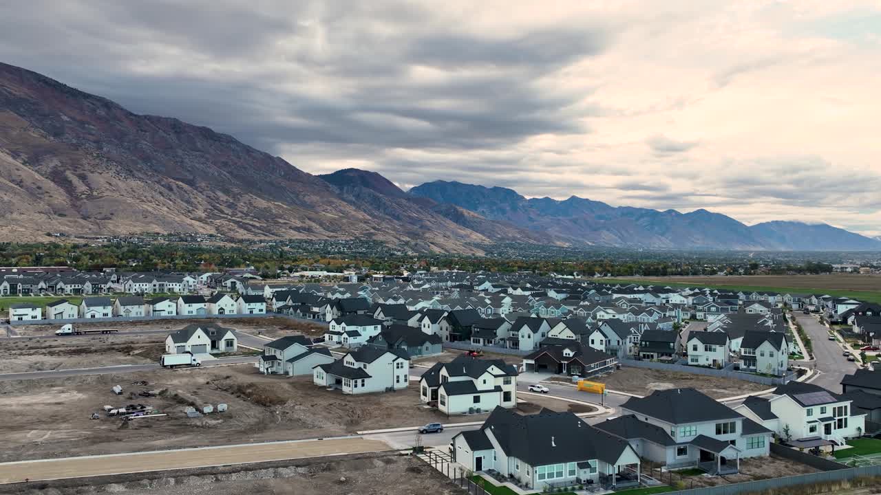 Housing Community At The Foothills Of The Wasatch Front Mountains In Highland, Utah. Descending Aerial Shot