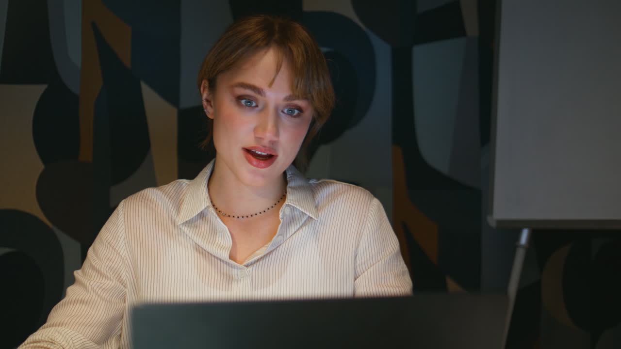 Happy woman consulting online at evening office closeup. Late work video call