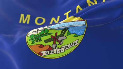 bandera del estado estadounidense de montana, estados unidos, ondeando en el viento.