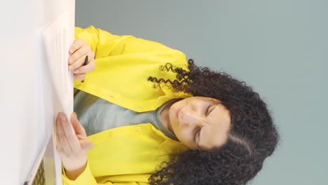 Vertical-video-of-The-young-woman-who-signed-the-paperwork.