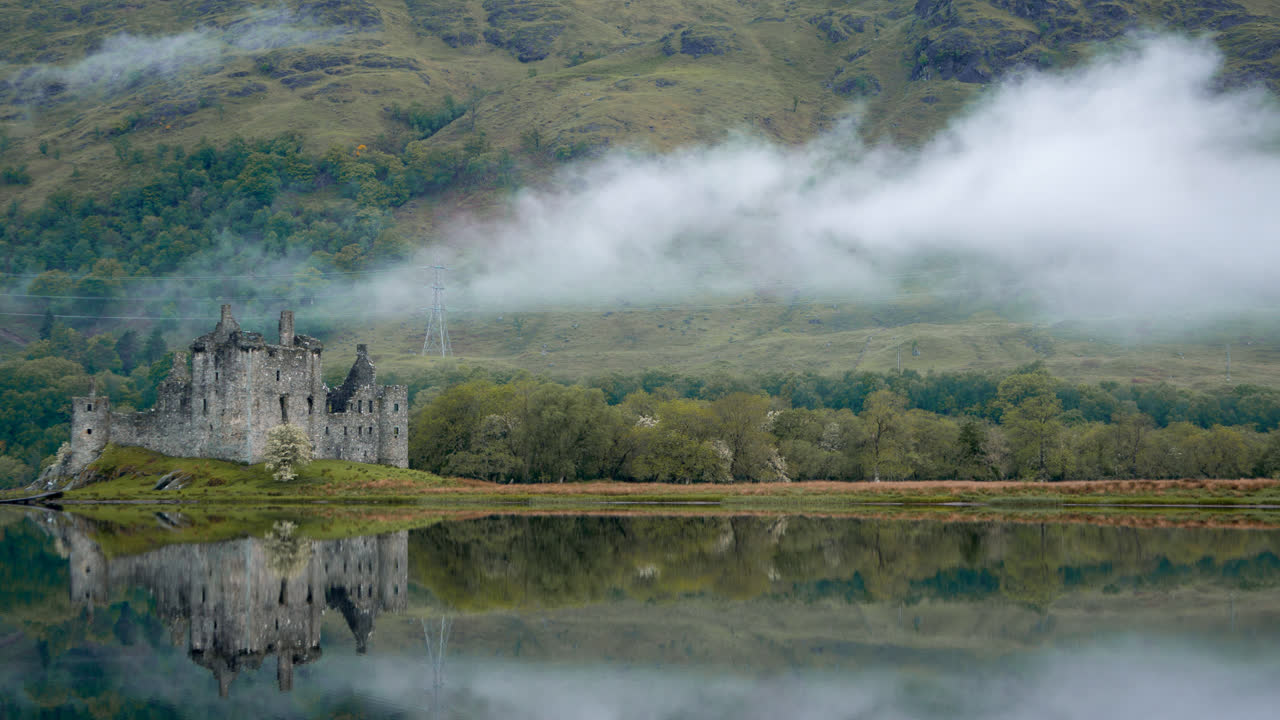 HD - Kilchurn Caste in the Morning  with Low Clouds- Calm Reflection