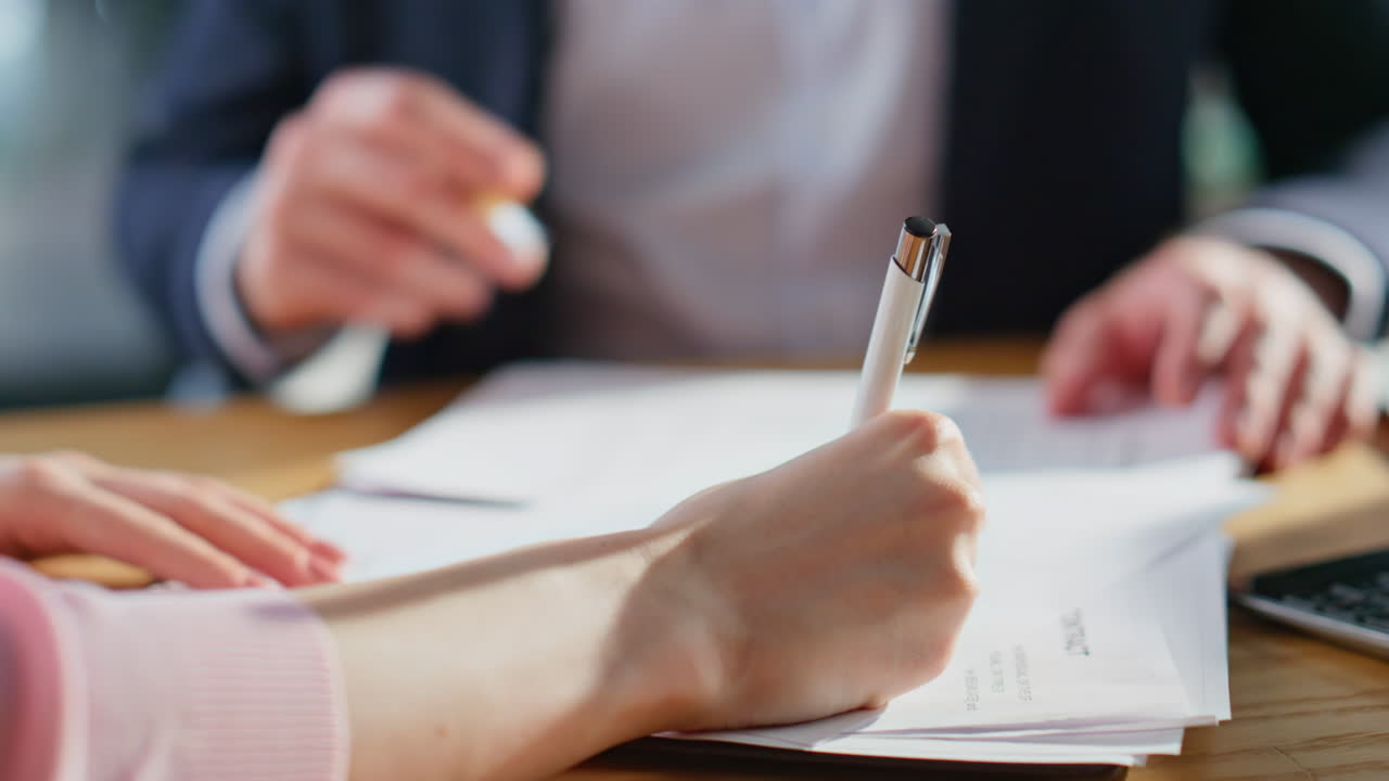 Business people shaking hands concluding deal in corporate office closeup