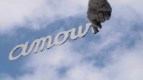 Close-up-Of-Amour-Sculpture-In-De-Haan,-North-Sea,-Belgium