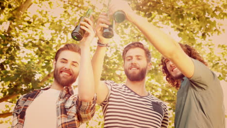 hipsters toasting with beer bottles