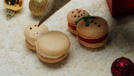 decorating christmas snowman macarons