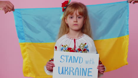 upset toddler ukrainian girl protesting war conflict raises inscription massage hands off ukraine