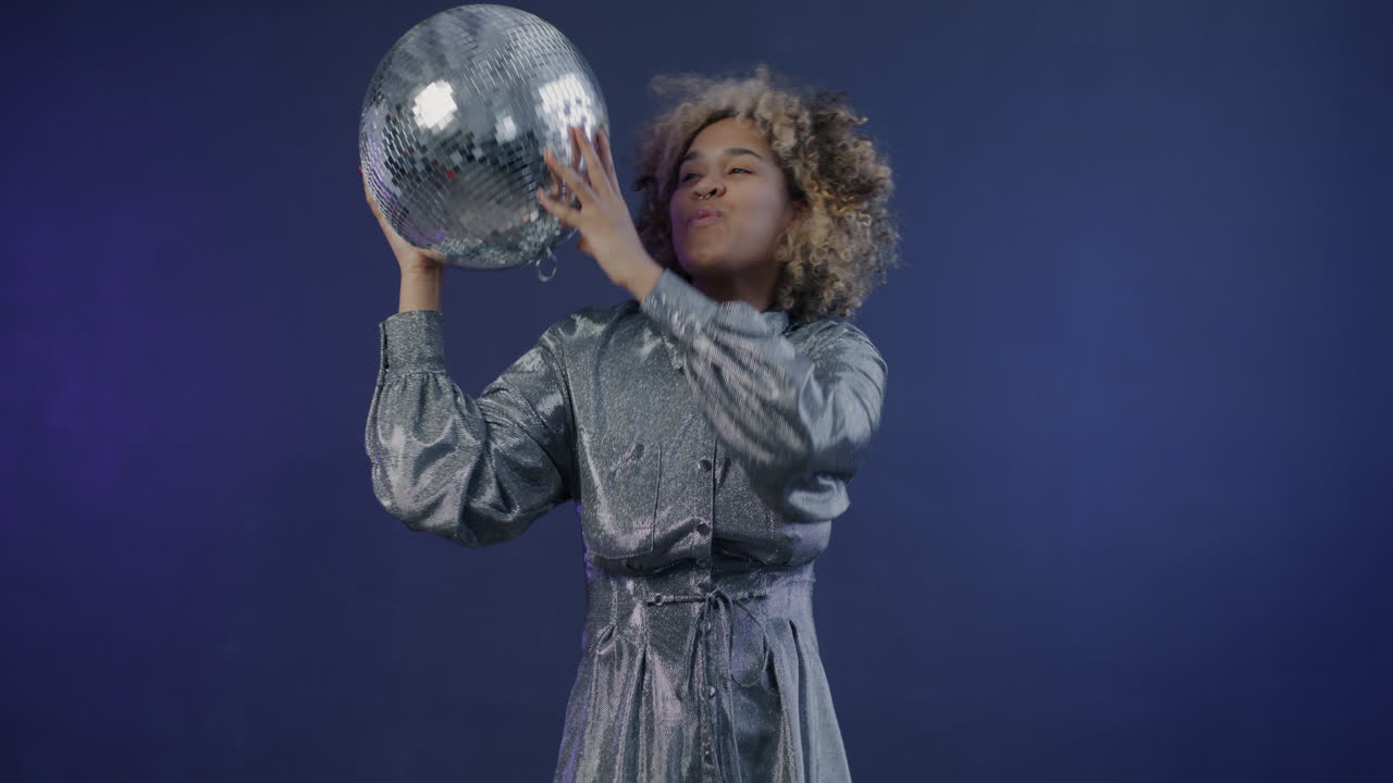Woman Dancing with Disco Ball