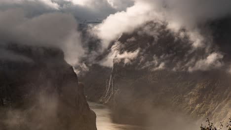 thick clouds heavy with rain whirling above the geiranger fjord