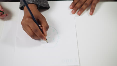 black man tutor draws doubting face learn emotions with girl