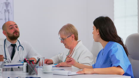 team of doctors having medical conference dividing their tasks