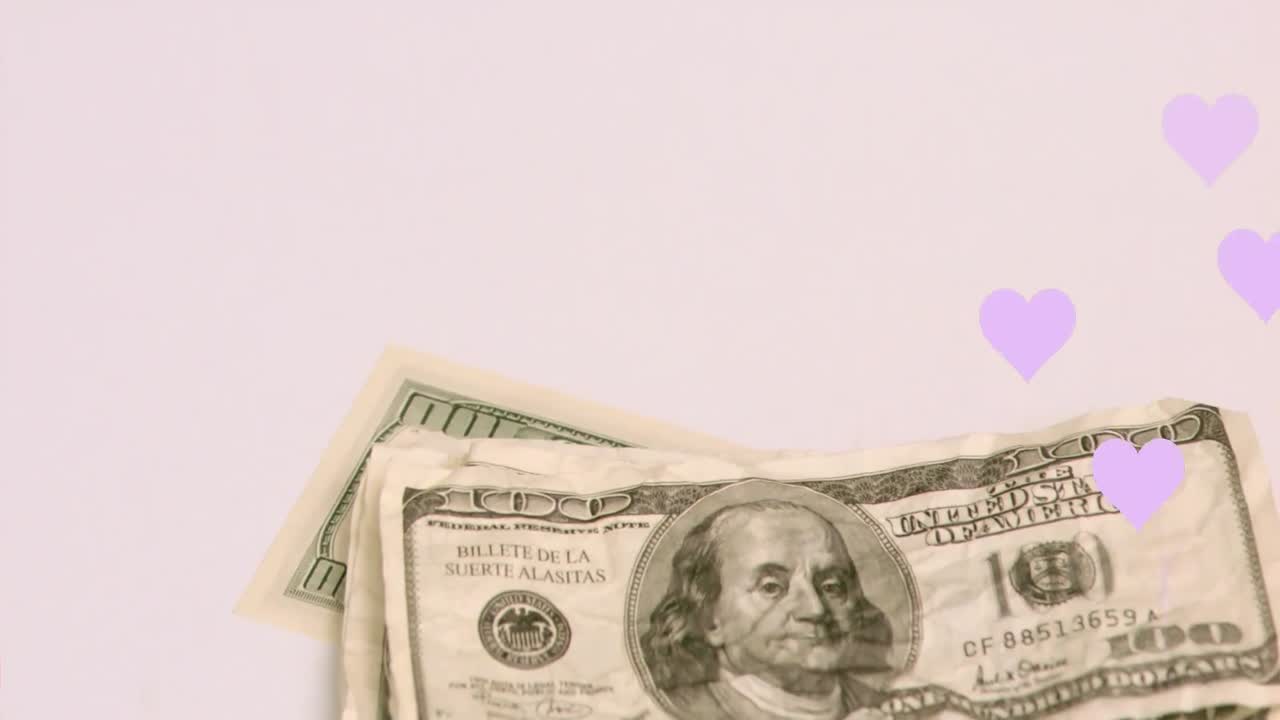 하 ⁇  바탕에 있는 심장 아이콘과 달러 지폐의 애니메이션