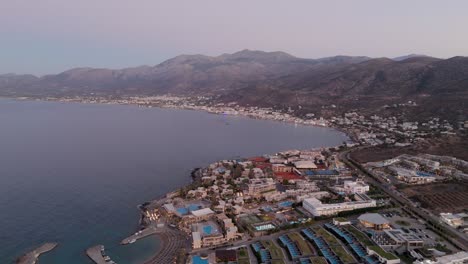 aerial view of chersonissos hotels overlooking the bay towards malia village, crete