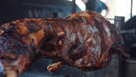 roasted pig on a spit