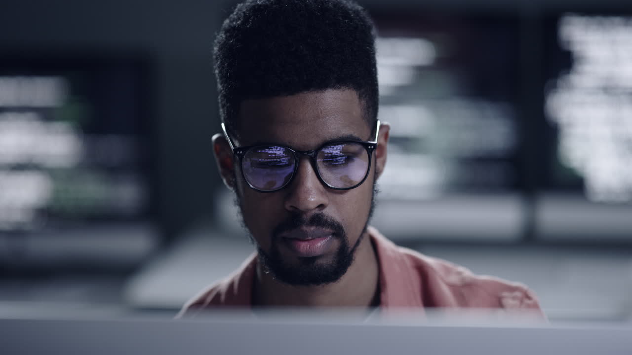 4k footage of a young male programmer looking up