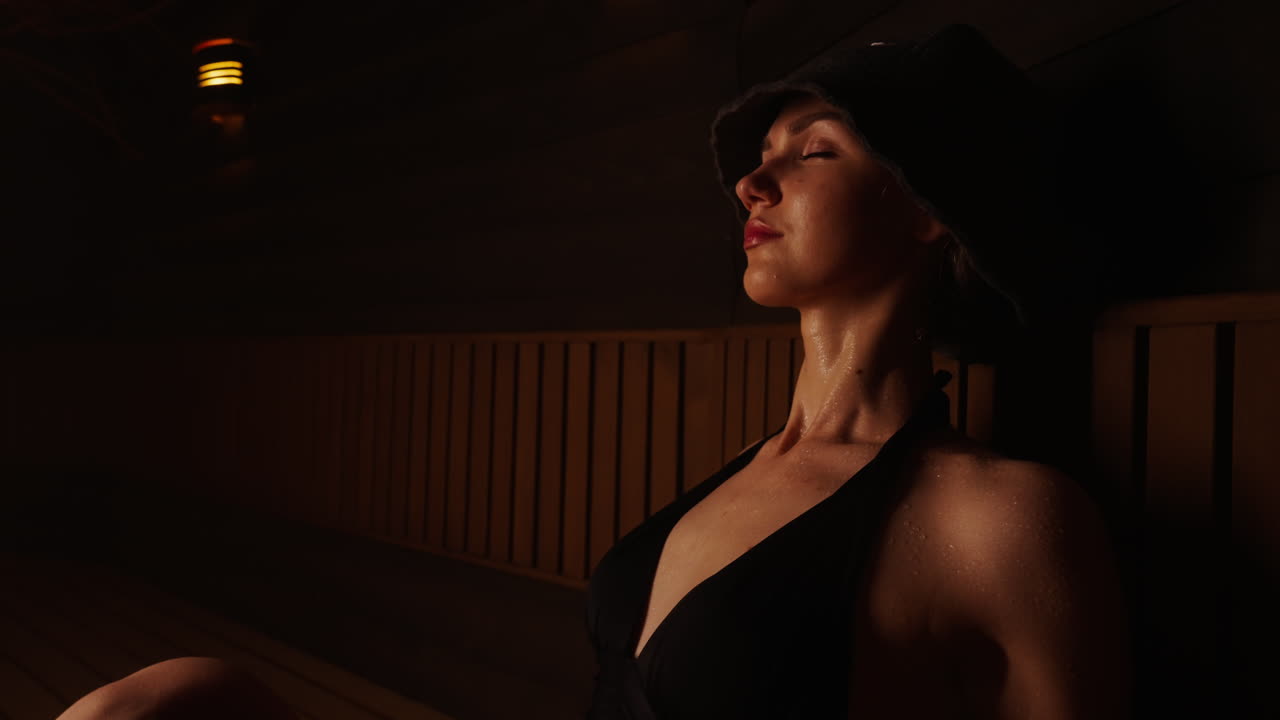 Woman relaxing in a sauna