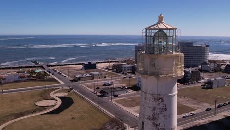 jersey shore lighthouse revealed with aerial backwards movement framed right