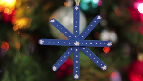 blue snowflake hanging, made of popsicle sticks