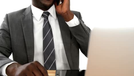 Businessman-talking-on-mobile-phone