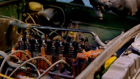 male mechanic servicing a car in garage 4k