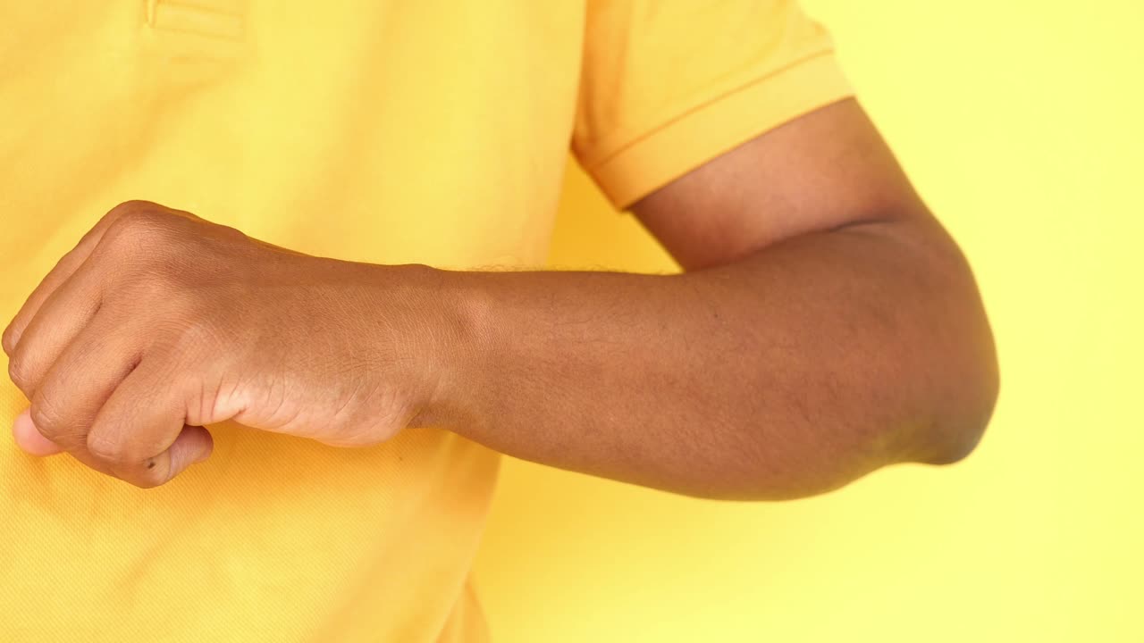 Person scratching their arm due to itching or skin irritation