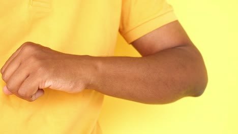 person scratching their arm due to itching or skin irritation